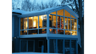 A solid roof sunroom photographed in the winter.