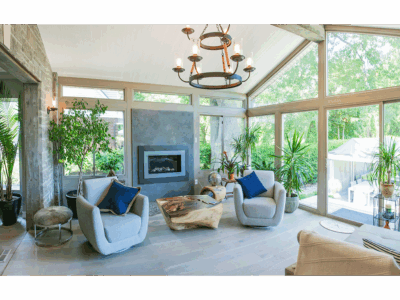 A modern 4 season sunroom decorated in bright, yet relaxing colors and style.