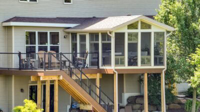 A beautiful sunroom with a gable roof on a Wisconsin Spring day