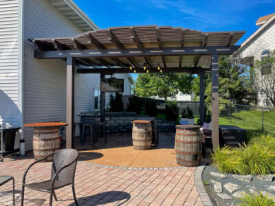 A custom pergola set over a decorated patio in Wisconsin